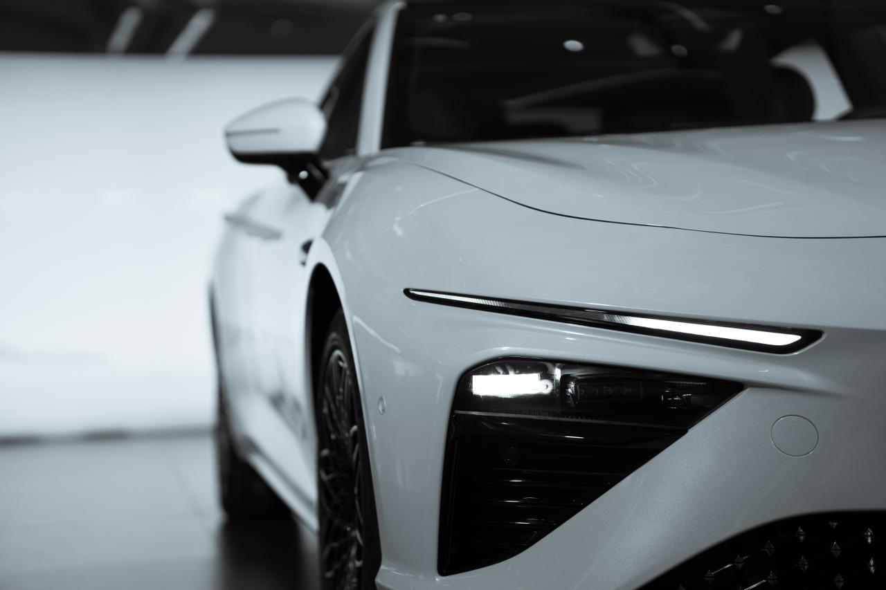 a white car with its front facing the camera