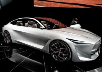 white porsche 911 parked on black floor